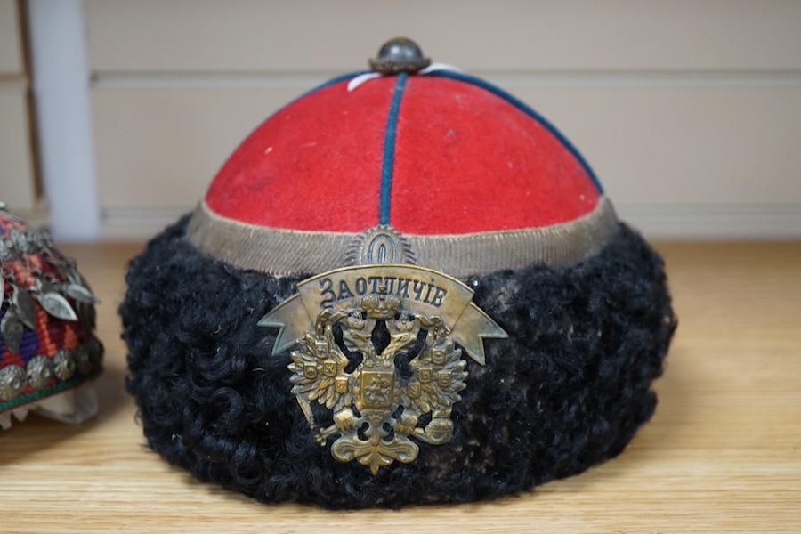 An Imperial Russian 13th Erivan Grenadier Regiment Caucasian Corps Officer's Papakha - 19 cm high and an Afghan woman's skull cap (taqiyah). Condition - both good